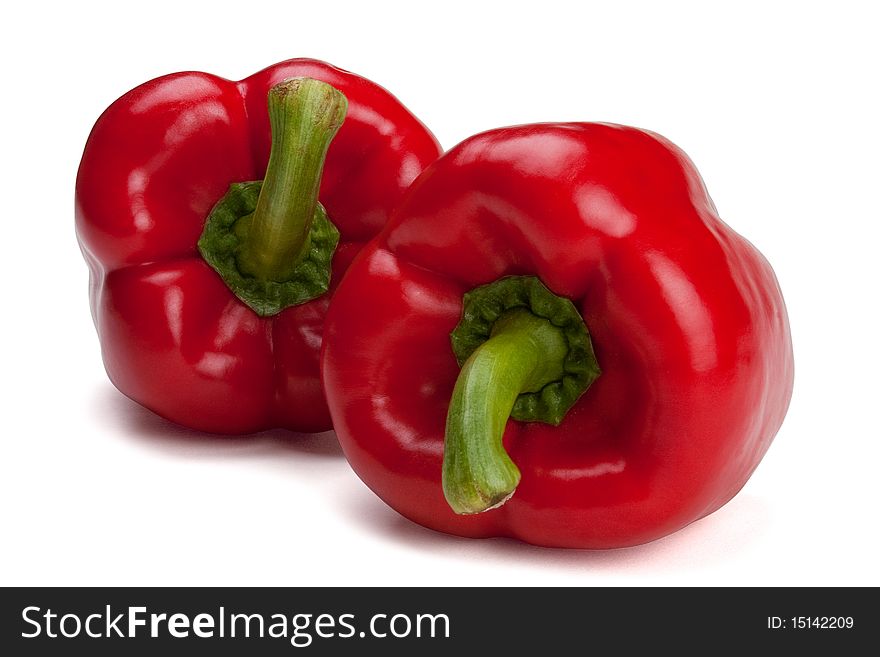 Red bell peppers isolated with a path