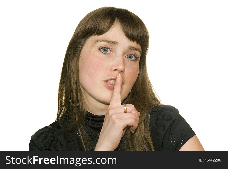 Girl with finger near by lip insulated on white background. Girl with finger near by lip insulated on white background