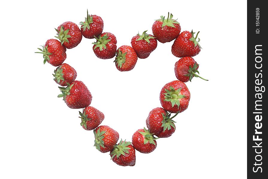 Heart made from strawberries isolated on white background with clipping path