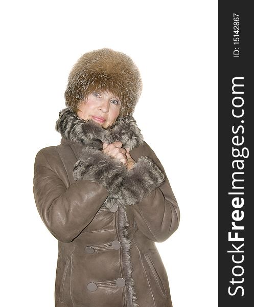 Woman in fur coat insulated on white background
