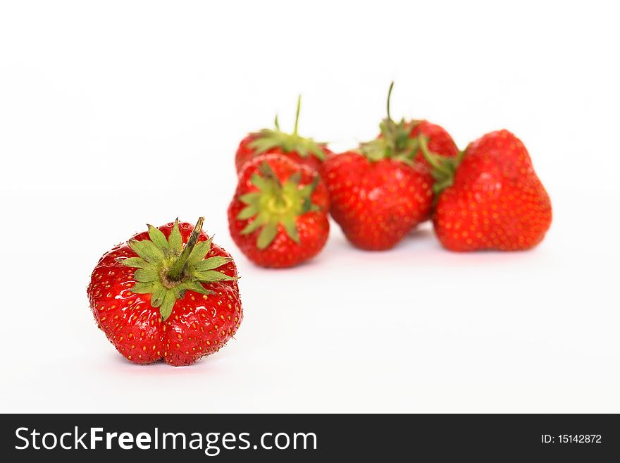 Few red freshness strawberries lying on white background. Few red freshness strawberries lying on white background