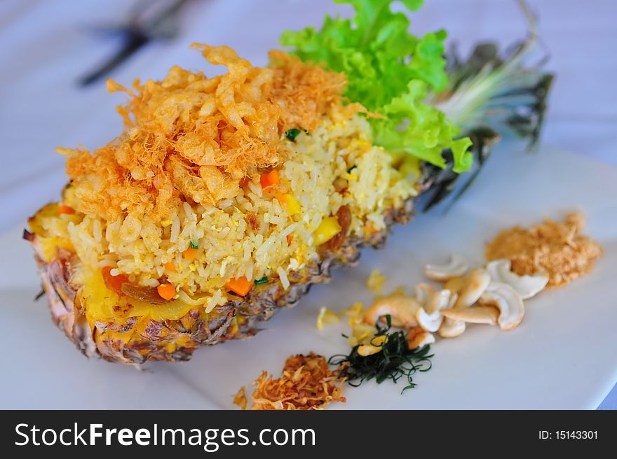 A plate of thai-style baked pineapple rice