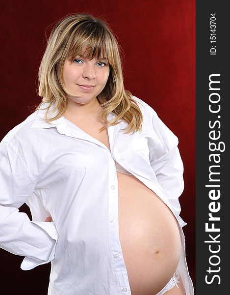 Pregnant woman  on a red background