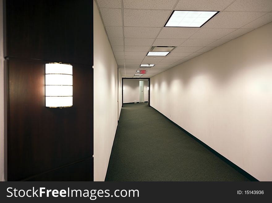 Empty office building hallway after hours