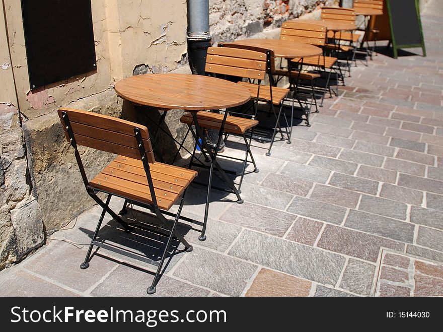 Wooden chairs over the table in little restaurant