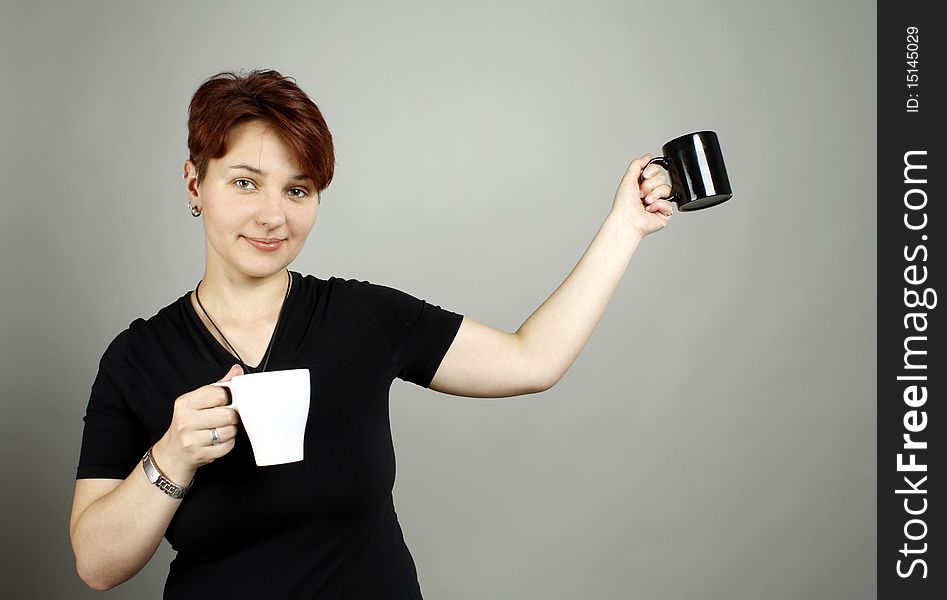 A girl with two cups, black and white. A girl with two cups, black and white