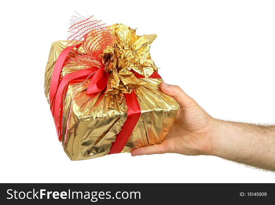 The man's hand holds a gift a box, is isolated on a white background