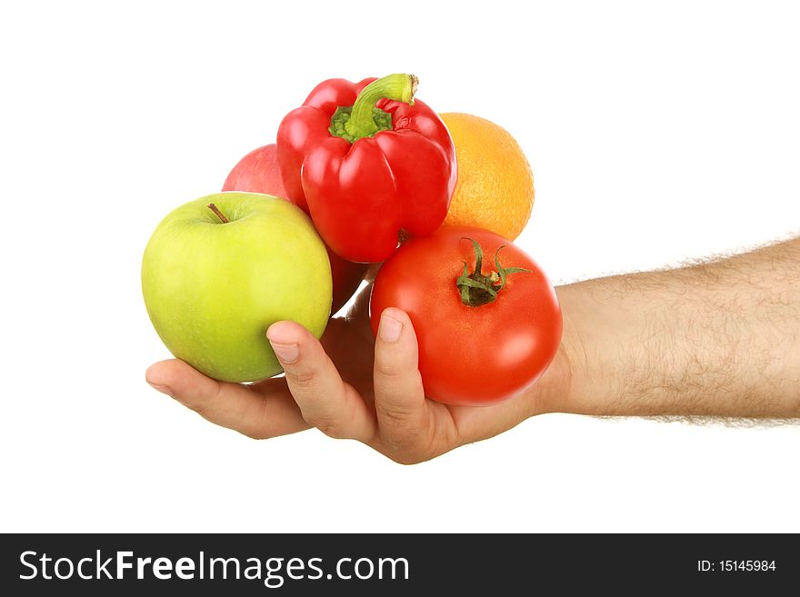 The man's hand holds fruit, is isolated on a white background