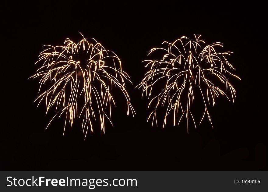 Fireworks producing golden sparks/flames. Fireworks producing golden sparks/flames