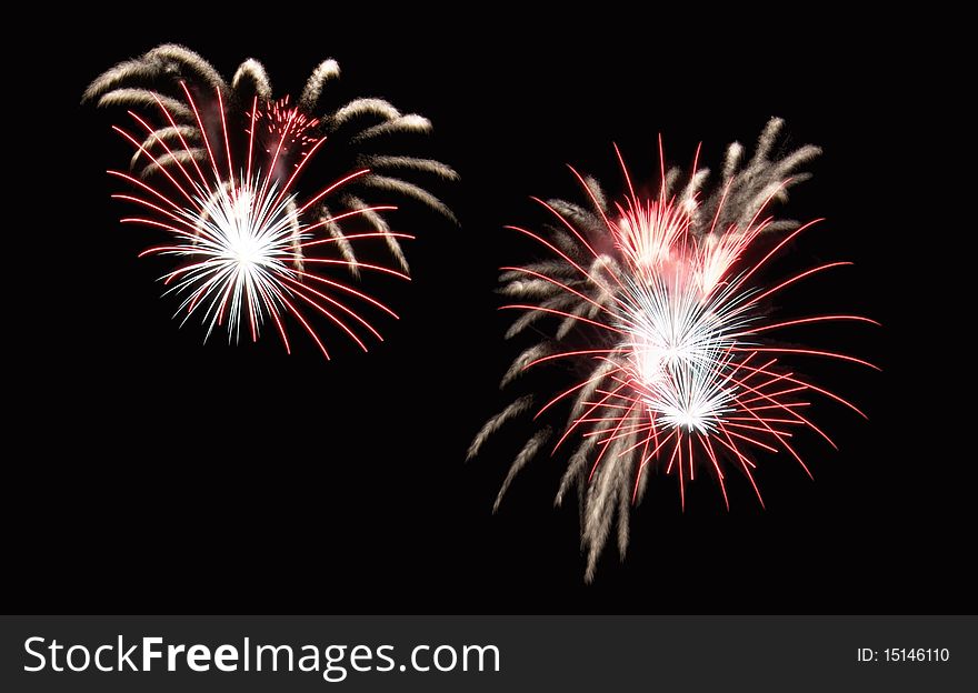 Fountain fireworks creating red and white shower effects. Fountain fireworks creating red and white shower effects.