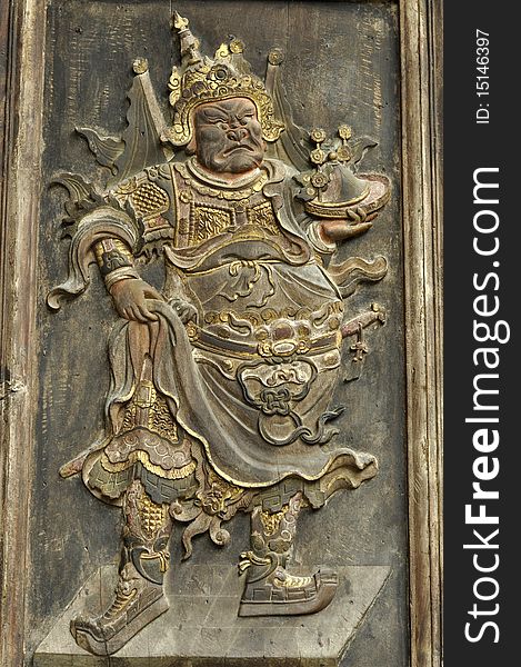 Image of a deity on a Chinese temple door. Image of a deity on a Chinese temple door.