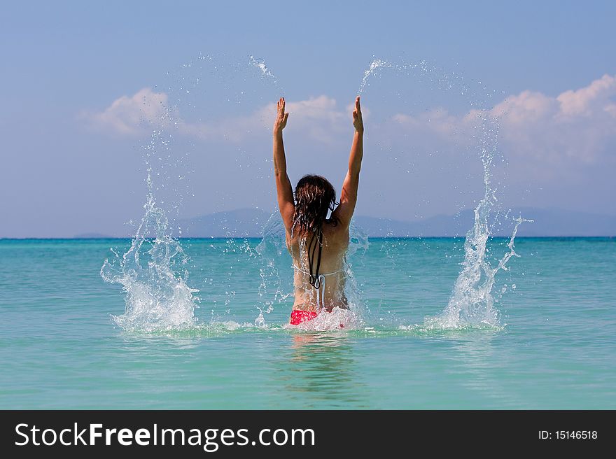 Girl with long hair playing in the sea. Girl with long hair playing in the sea