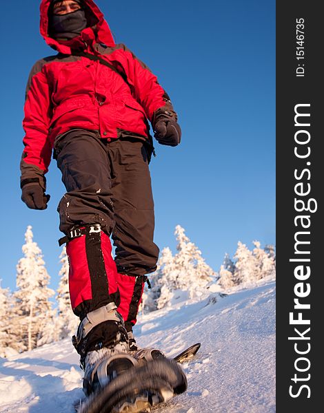 Hiker in winter in mountains