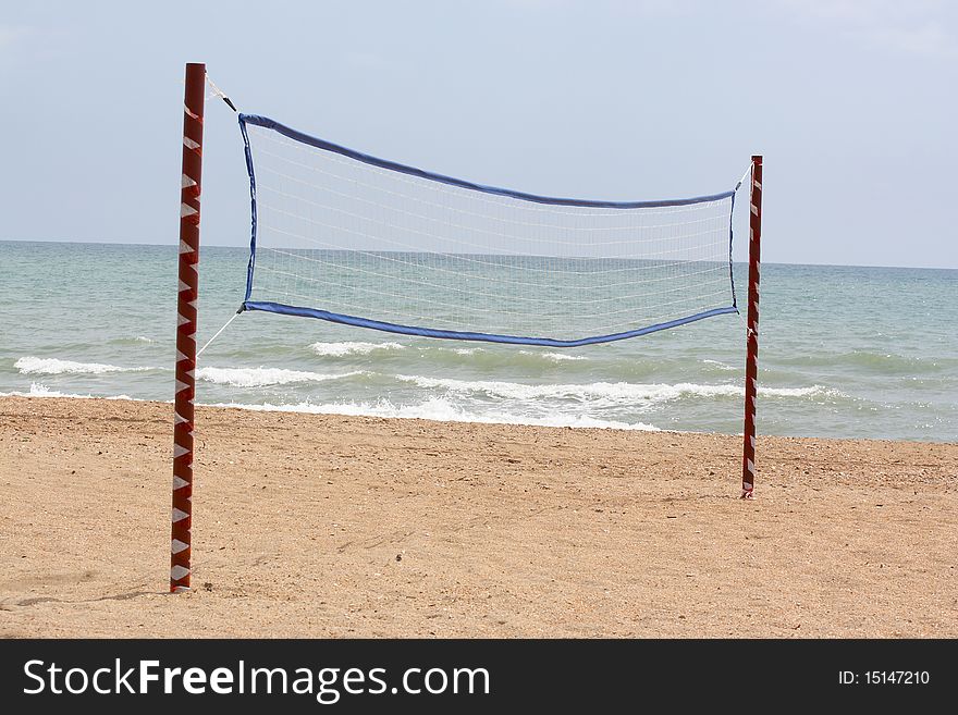The image of volleyball net on a beach