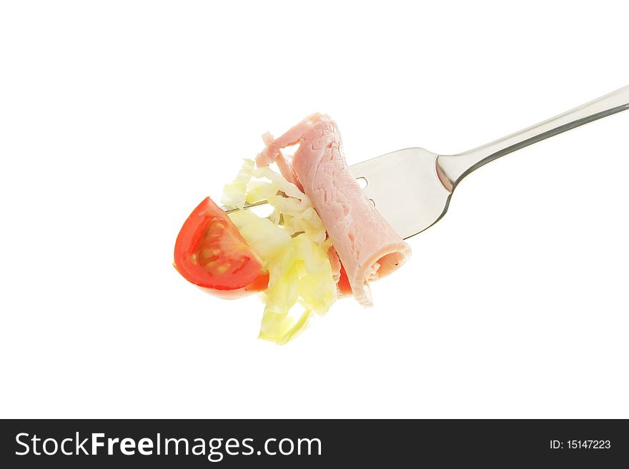 Tomato,lettuce and ham on a fork. Tomato,lettuce and ham on a fork