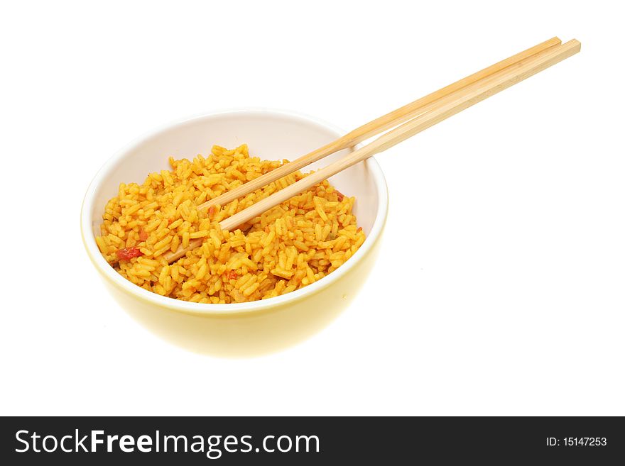 Bowl of rice with chopsticks isolated on white