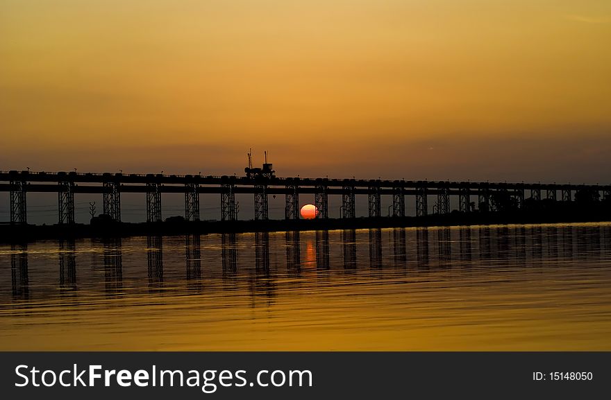 Sunset and a silhouette of a bridge. Sunset and a silhouette of a bridge