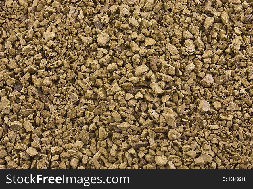 Instant coffee background. many brown coffee granules.