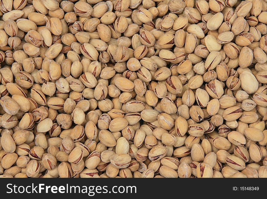 Background of roasted and salted pistachios. Background of roasted and salted pistachios