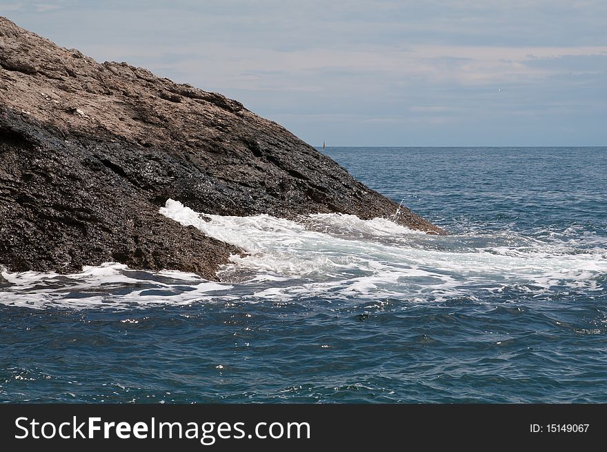 Black Sea. Sea surf. Kind of a wave crashed against the rocks.