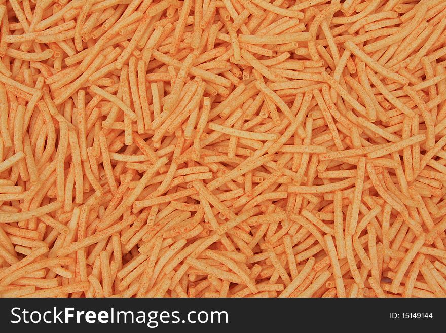 Background of orange cheese puffs