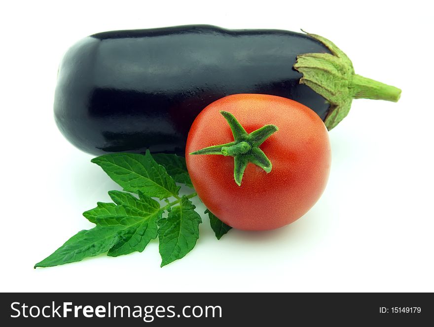 Ripe eggplants with tomato on white background