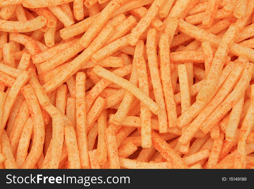 Background of orange cheese puffs