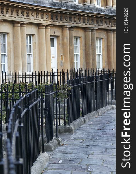 Curve of iron railings in front of Georgian facades in the Circus, Bath.