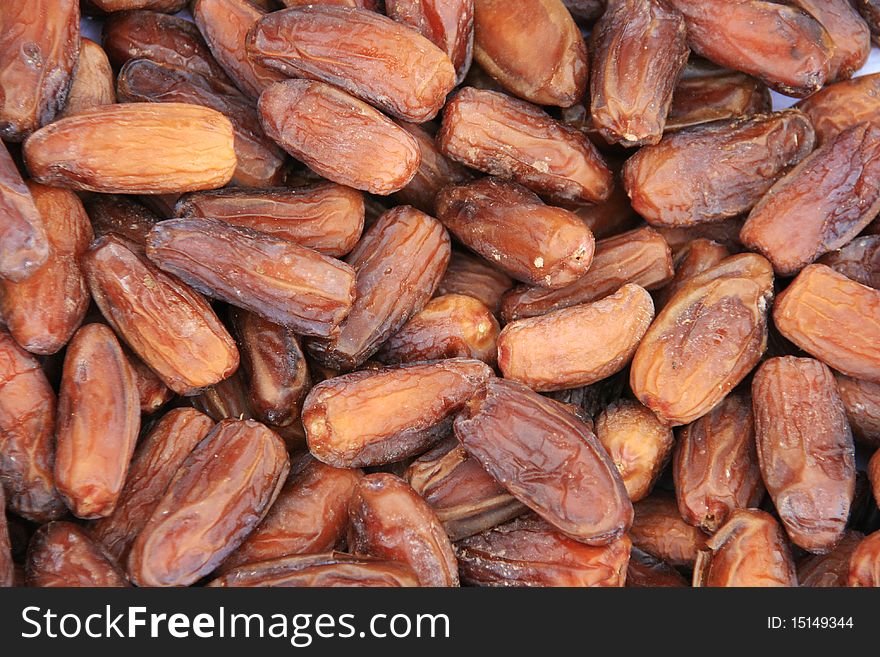 Background of brown dried dates. Background of brown dried dates