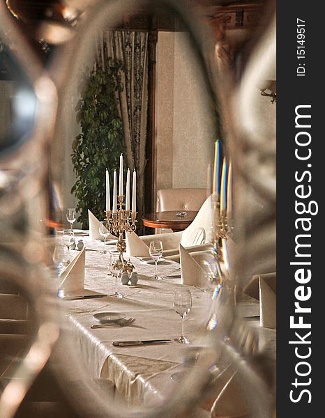 Reflection of interior of restaurant in miror in classical style. Reflection of interior of restaurant in miror in classical style