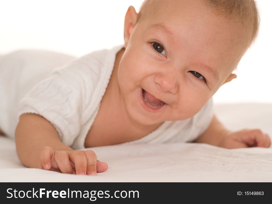 Portrait of a happy baby  on a white