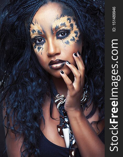 Beauty afro girl with cat make up, creative leopard print closeup, fashion style halloween look