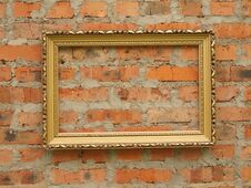 Picture Frame From Baguette On The Background Of An Old Brick Wall Stock Image