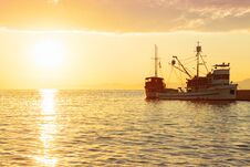 Fishing Trawler At Sunrise Moored In The Beautiful Harbor Of A Small Town Postira - Croatia, Island Brac Stock Photos Fishing Trawler At Sunrise Moored In The Beautiful Harbor Of A Small Town Postira - Croatia, Island Brac Stock Photos