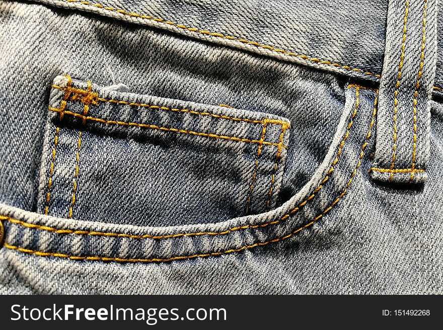 Front Right Pocket On Light-colored Jeans.