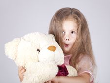 Little Shouting Girl Embraces Bear Cub. Stock Photo Little Shouting Girl Embraces Bear Cub. Stock Photo