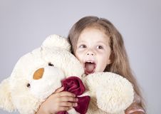 Little Shouting Girl Embraces Bear Cub. Stock Photography Little Shouting Girl Embraces Bear Cub. Stock Photography