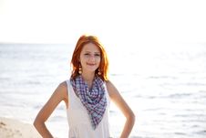 Beautiful Red-haired Girl At Sunrise On The Beach. Royalty Free Stock Photo Beautiful Red-haired Girl At Sunrise On The Beach. Royalty Free Stock Photo