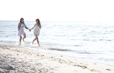Two Beautiful Girls Running On The Beach. Stock Photos Two Beautiful Girls Running On The Beach. Stock Photos
