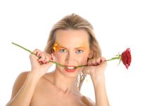 Young Woman Bites Flower Stalk Royalty Free Stock Image