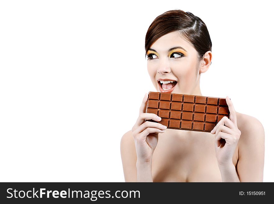 Shot of a beautiful young woman holding big chocolate bar. Shot of a beautiful young woman holding big chocolate bar.