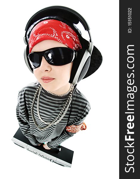 Shot of a trendy teenager listening to music in headphones. Isolated over white background. Shot of a trendy teenager listening to music in headphones. Isolated over white background.