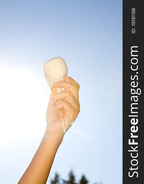 Hand holding icecream in summer