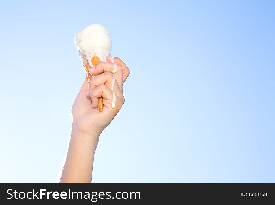 Hand holding icecream in summer