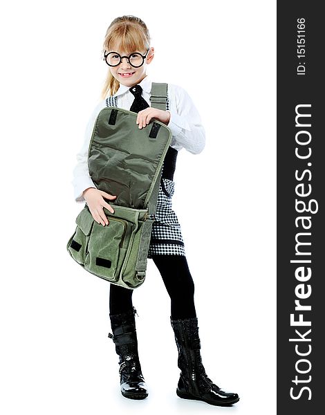Shot of a little girl in glasses with her school bag. Isolated over white background. Shot of a little girl in glasses with her school bag. Isolated over white background.