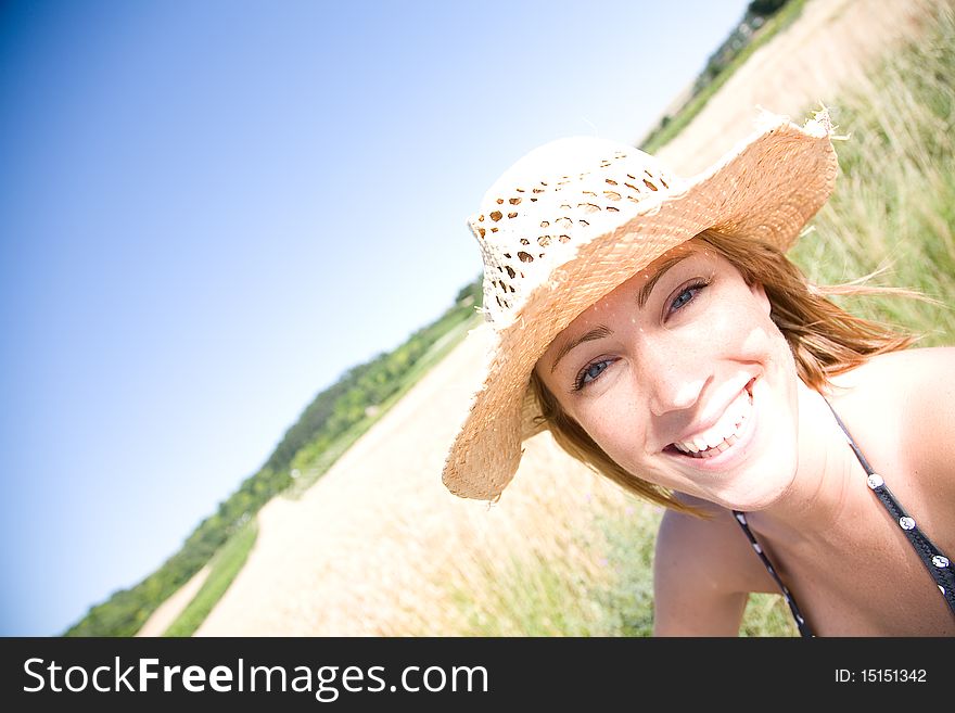 Young woman laughing on a summer day