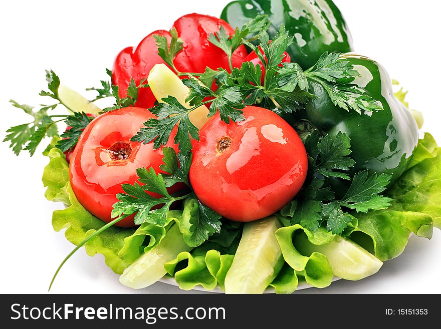 Food theme: fresh vegetables and greens on a plate. Food theme: fresh vegetables and greens on a plate.