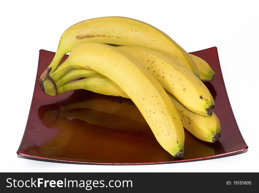 Dish with five yellow bananas for eating healthy
