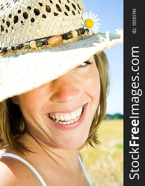 Young happy woman in summer with hat. Young happy woman in summer with hat