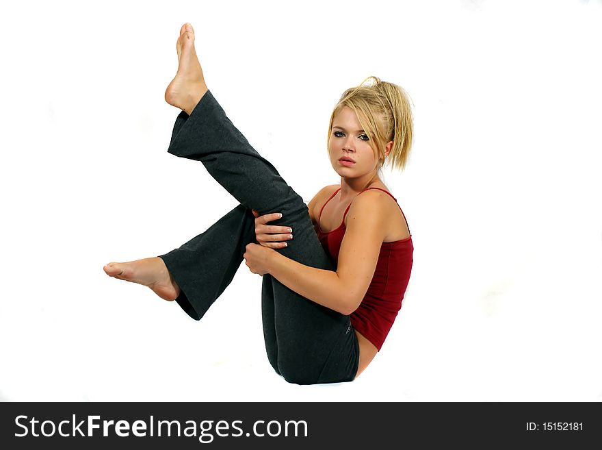 Young blonde beautiful girl performing fitness exercises. Young blonde beautiful girl performing fitness exercises